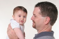 Dad Smiling At Baby